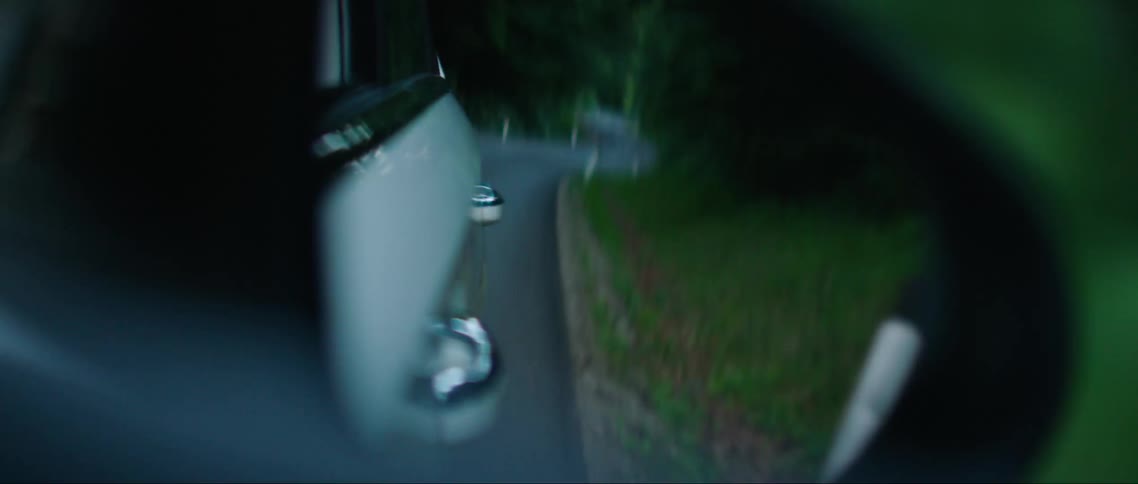 A car is driving on the road