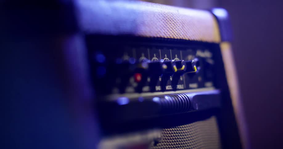Coloured light moves across a guitar amplifier