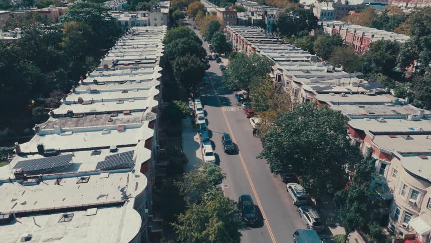Traffic on a road in a suburb