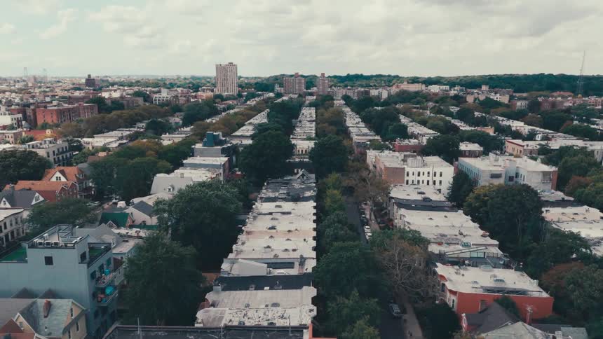 Aerial panorama of an urban city with residential buildings on a cloudy day