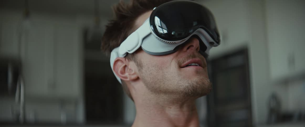 A man smiling while wearing vr glasses
