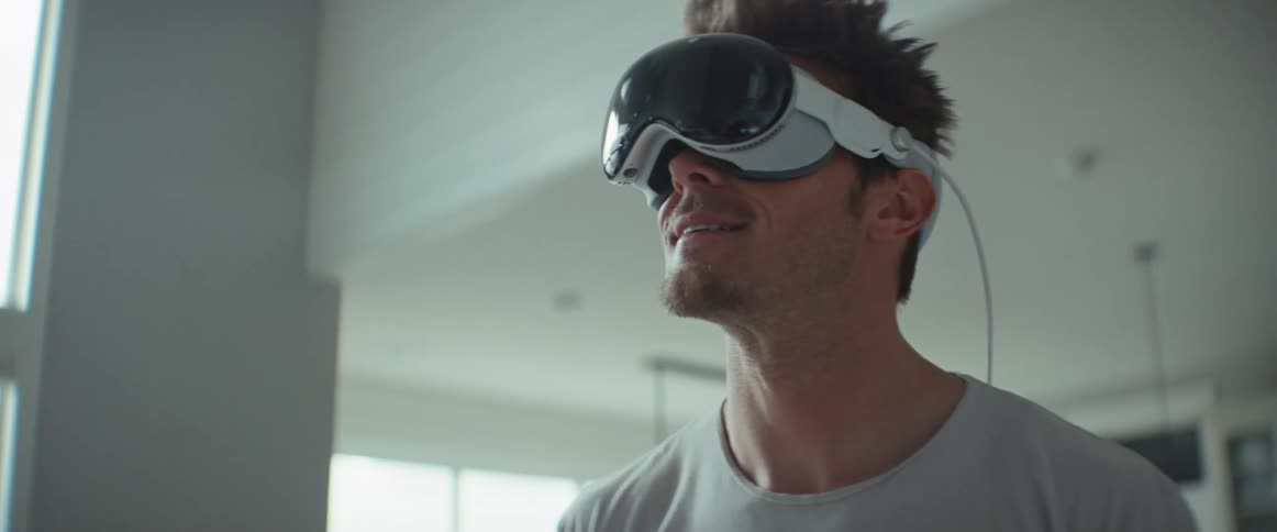 Man walking around the house using virtual reality glasses
