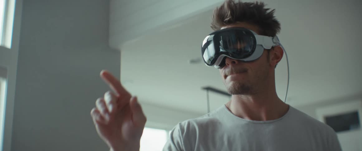 Man standing pointing at something while using virtual reality glasses