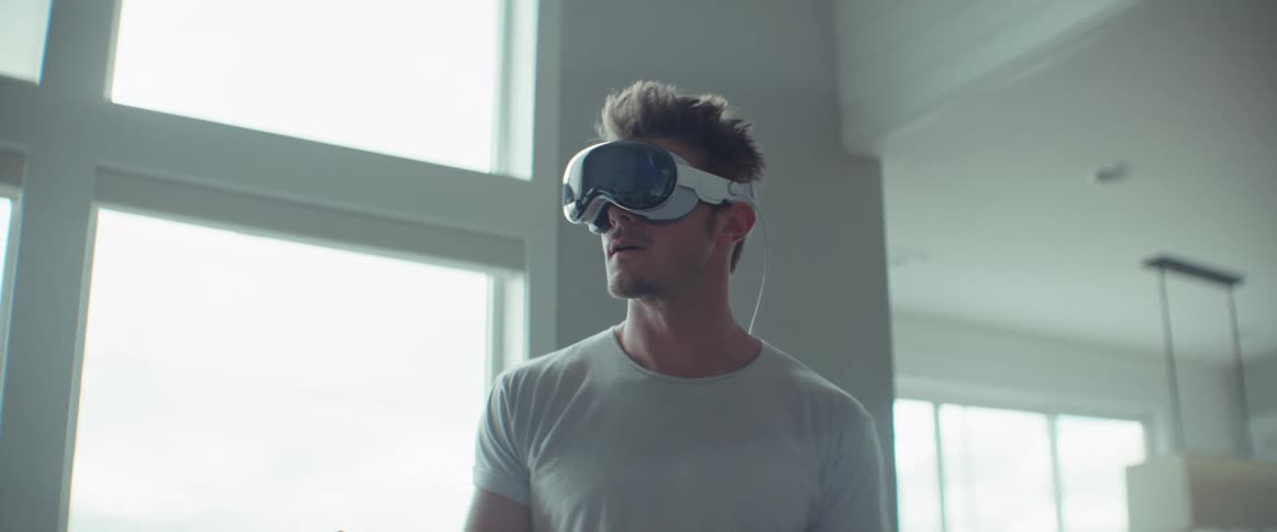 A man is using a virtual reality headset
