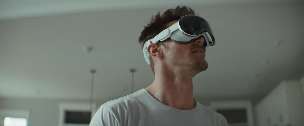 A man looks around wearing a virtual reality headset