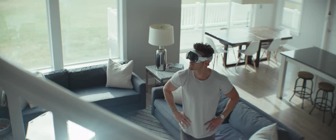 A man paces while using a virtual reality headset