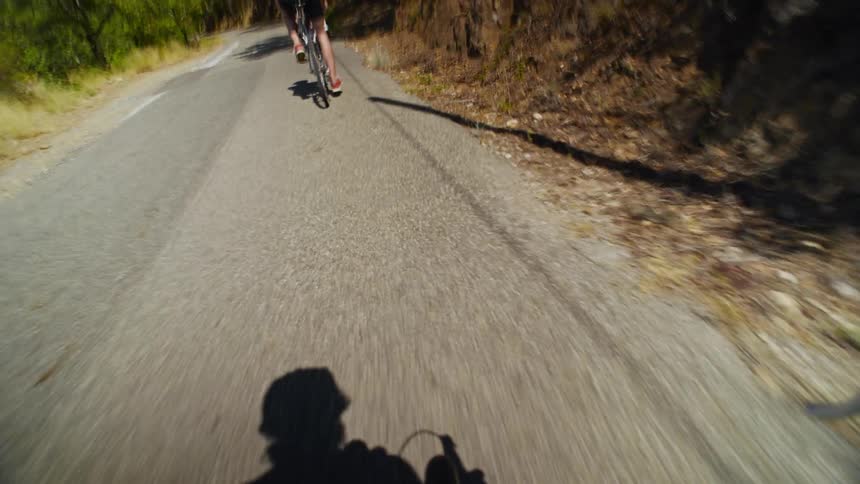 A person films himself riding a bike with friends