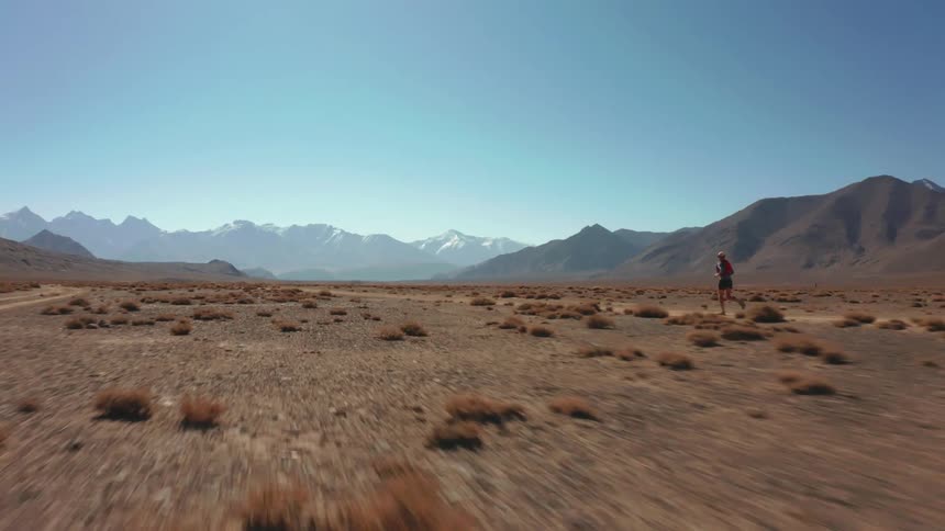 A man is running in the desert