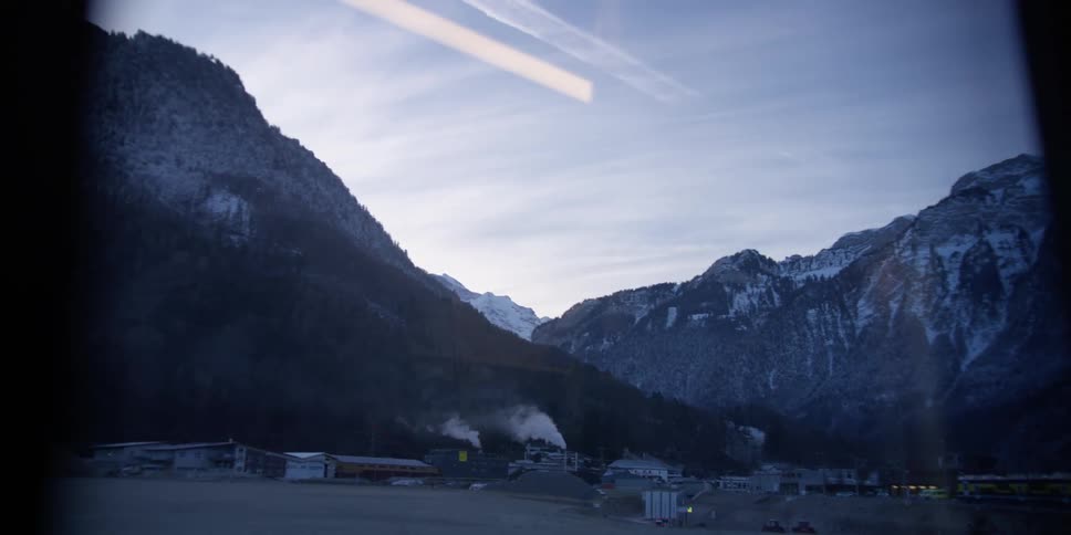 A factory is by the mountain range
