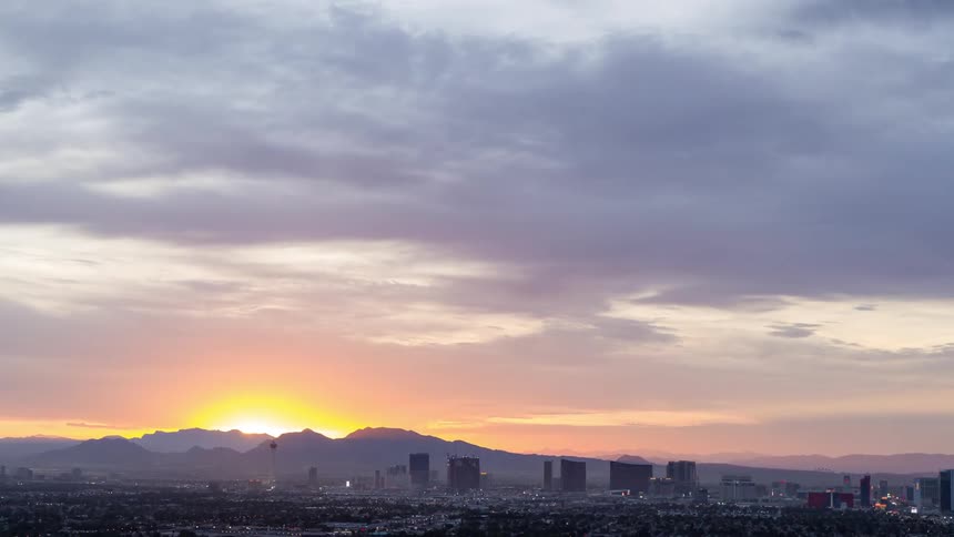 Sun rising over a large city