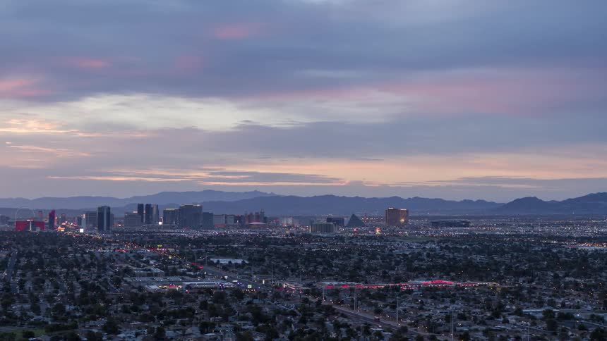 Aerial panorama of an urban city in the morning and mountains on the horizon