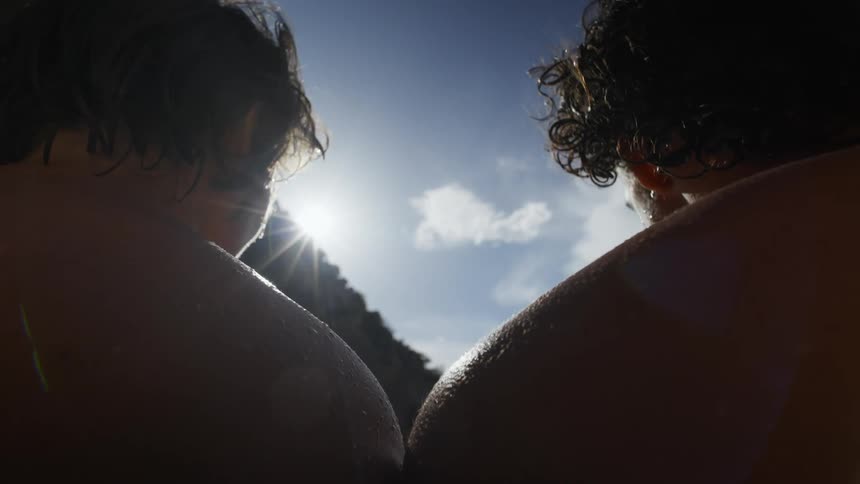 Two young men outdoors thinking