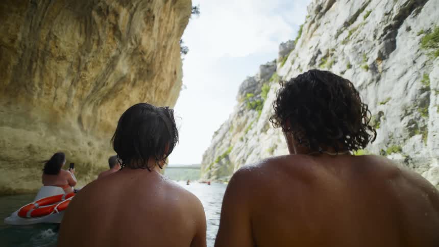 Two guys floating in a boat