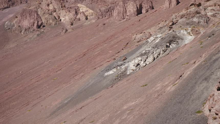 A large mountain with a rocky surface