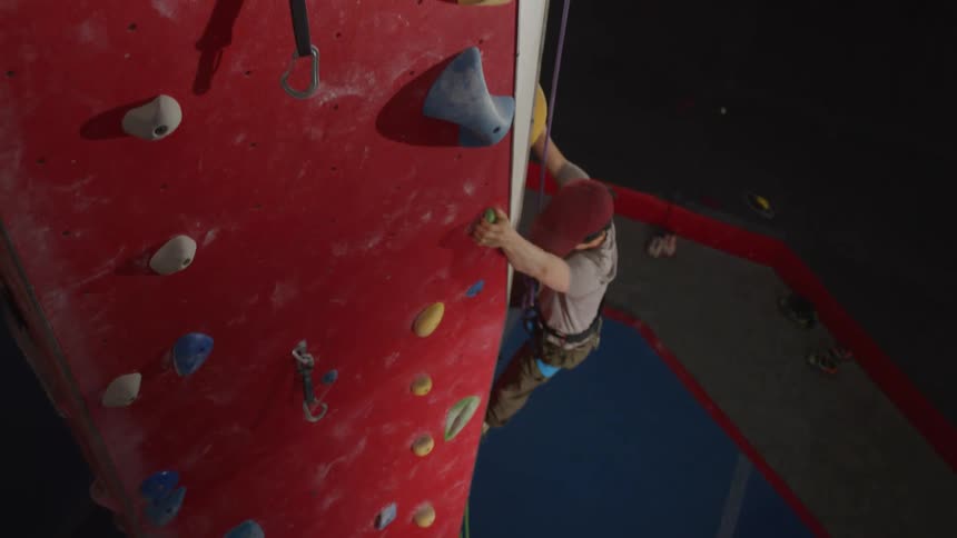 Man climbing on an indoor climbing wall