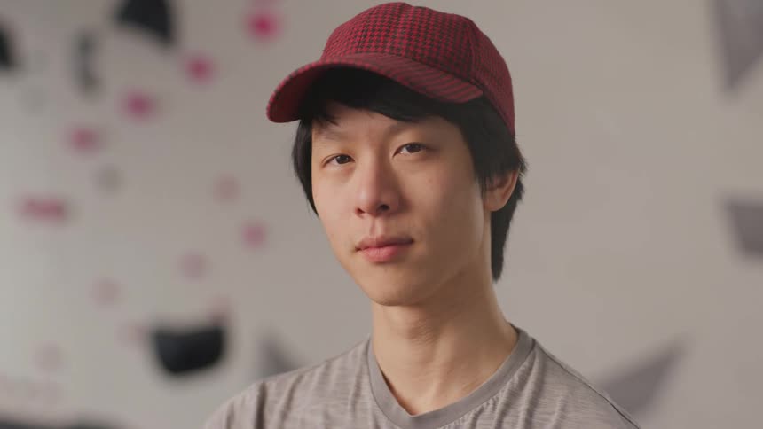 Portrait of a young man wearing a red cap
