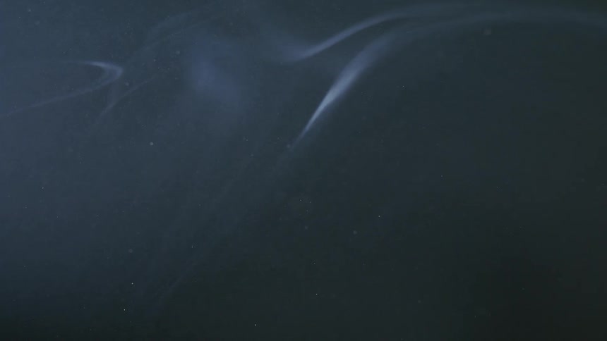 A garish white smoke on a black background