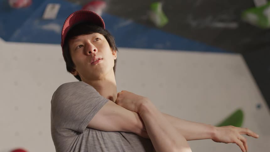 A man doing arm stretches