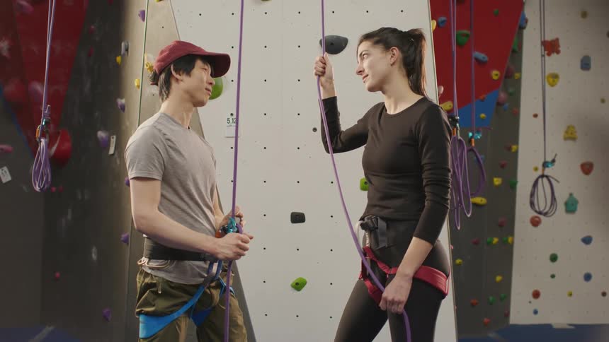 A man and a woman discuss how to tighten the security rope that ties them to each other