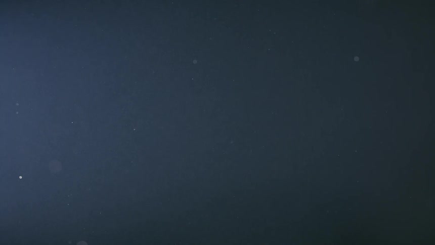An out of focus video of dots falling