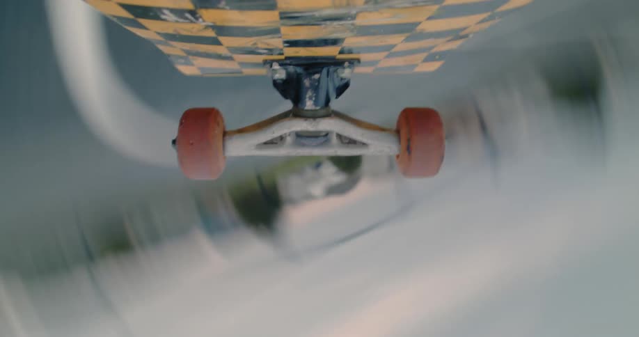 A skateboard flies over pavement