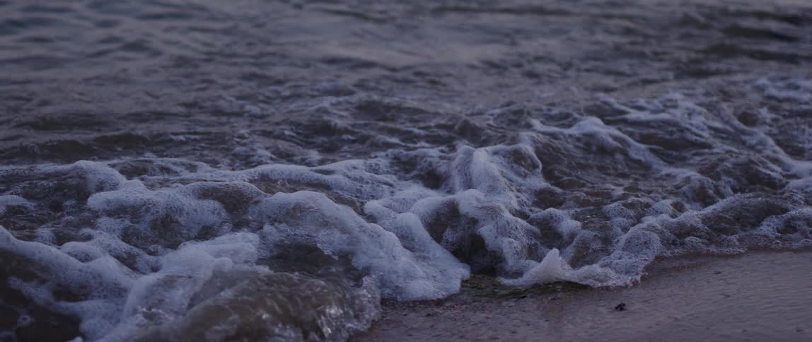 Huge waves cover a beach