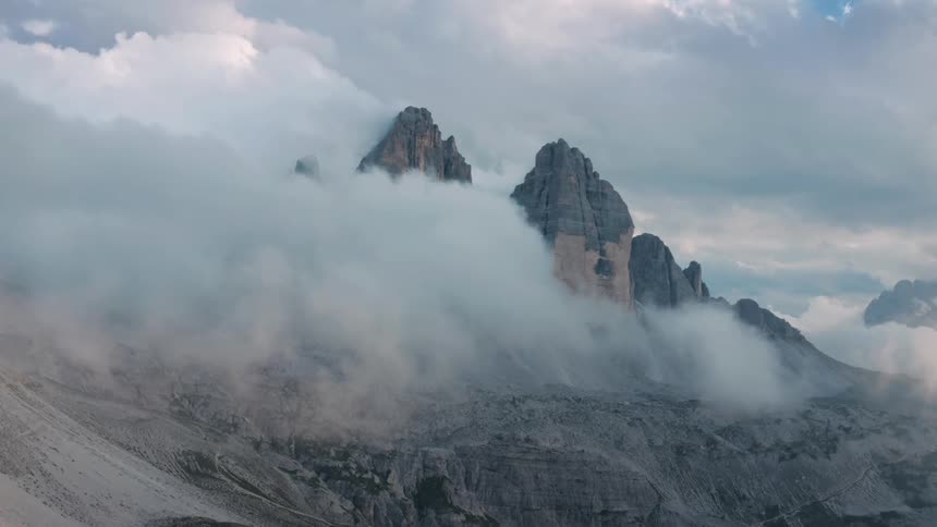 Mountain landscape with rocky cliffs and clouds around
