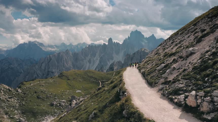 People are hiking on a mountain path