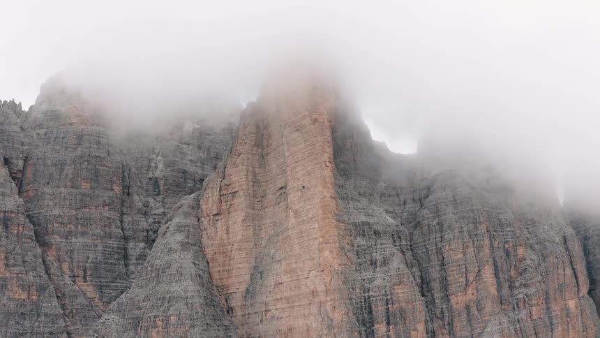 A mountain range partially obscured by haze