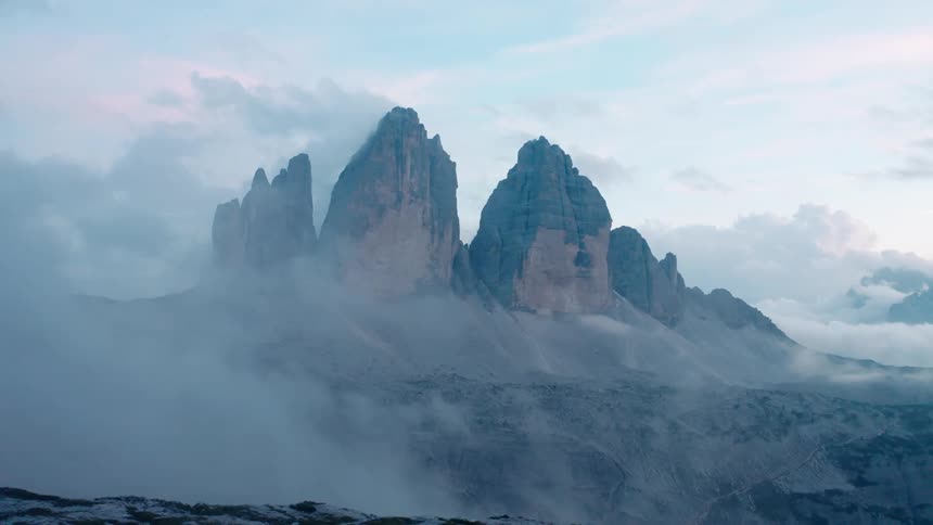 Clouds cover the summit of the mountains