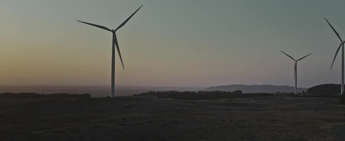 The sun rises on the windmills