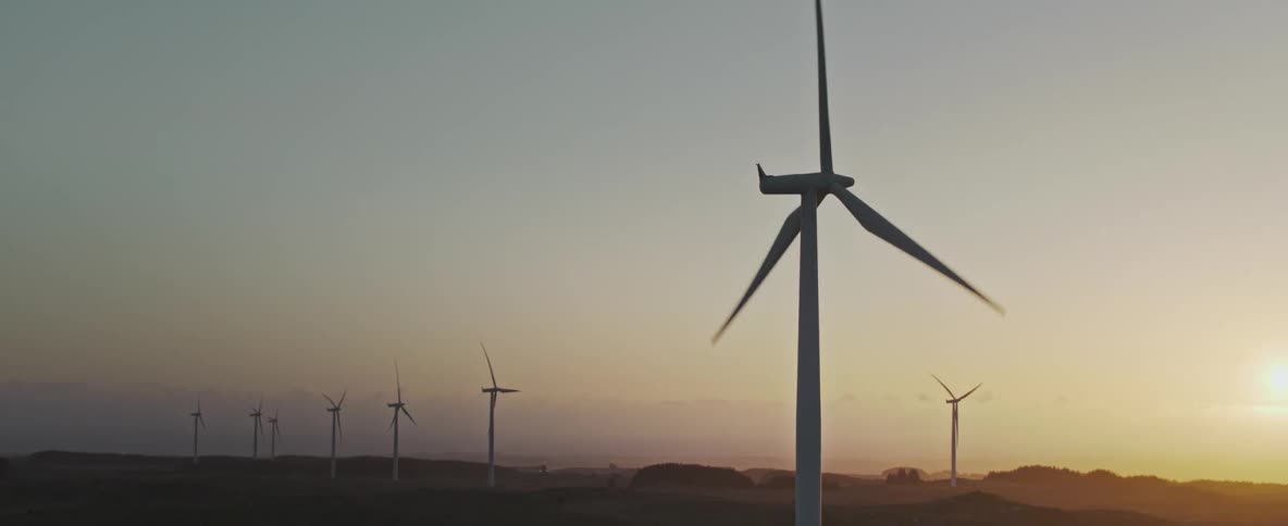 A windmill farm on flat terrain