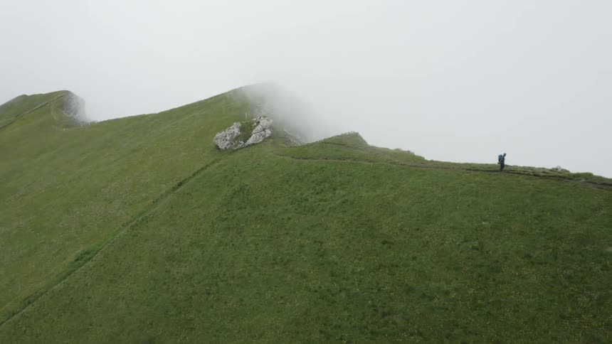 An aerial view of someone hiking on a mountain