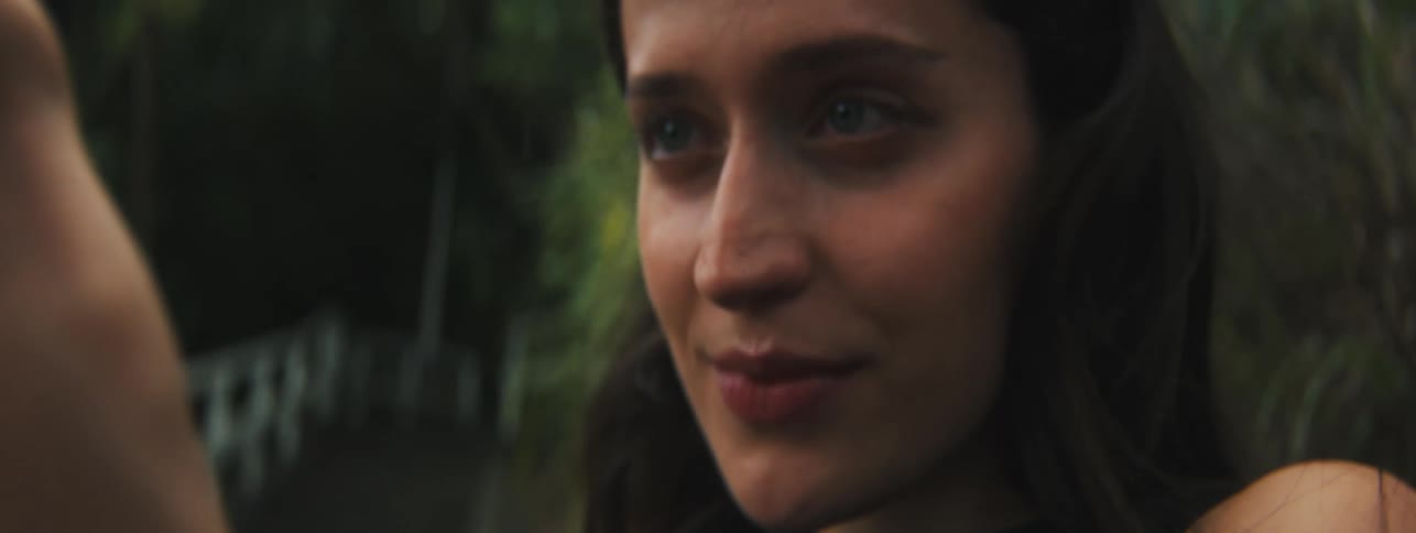 A woman uses a camera outdoors
