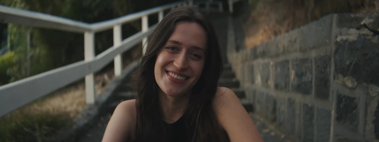 A lady smiling to the camera