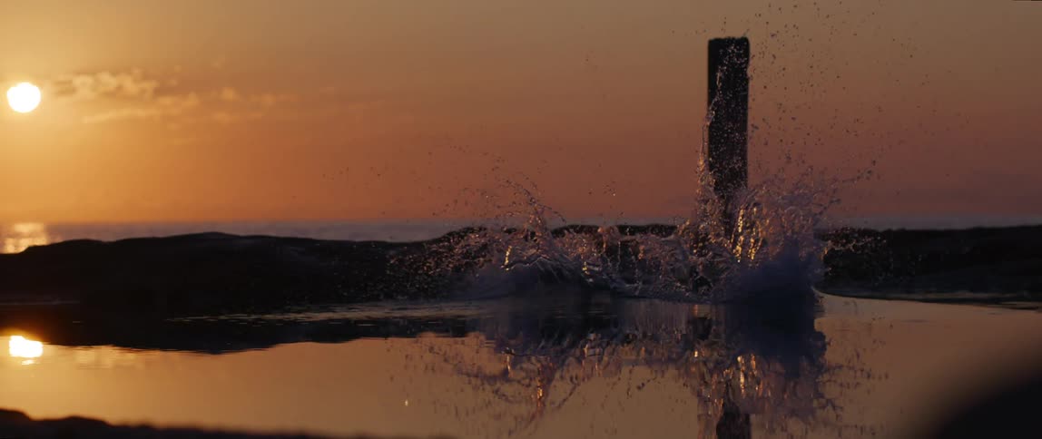A man dives into the ocean