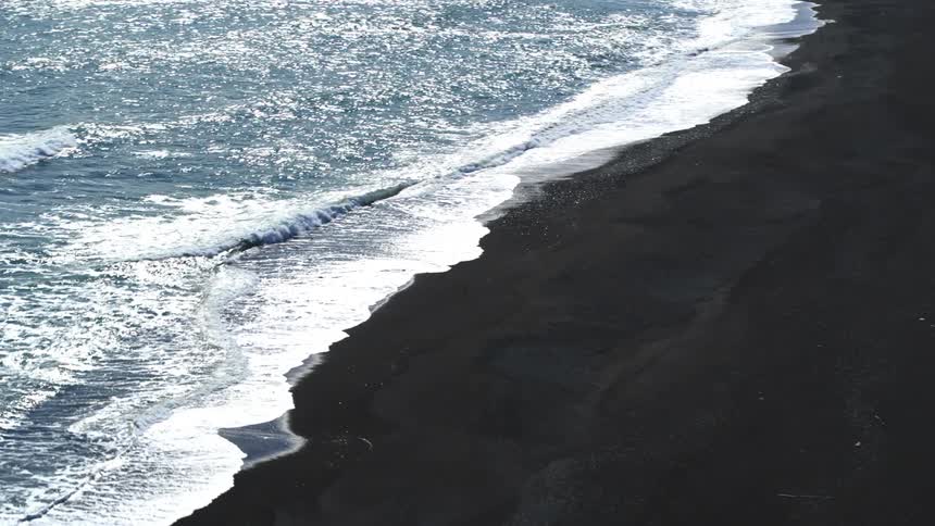 Waves crash against the shore