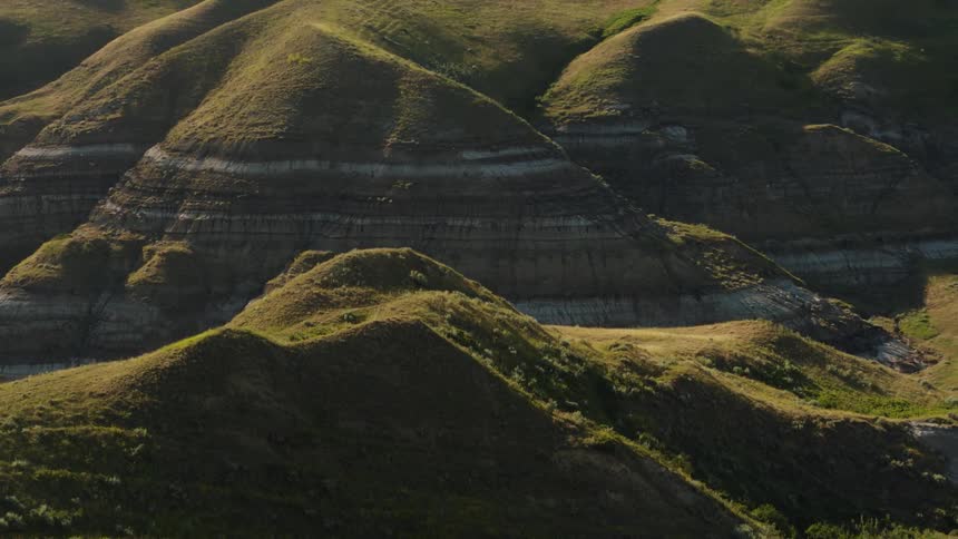 Aerial view of badlands coulee at dusk during the summer