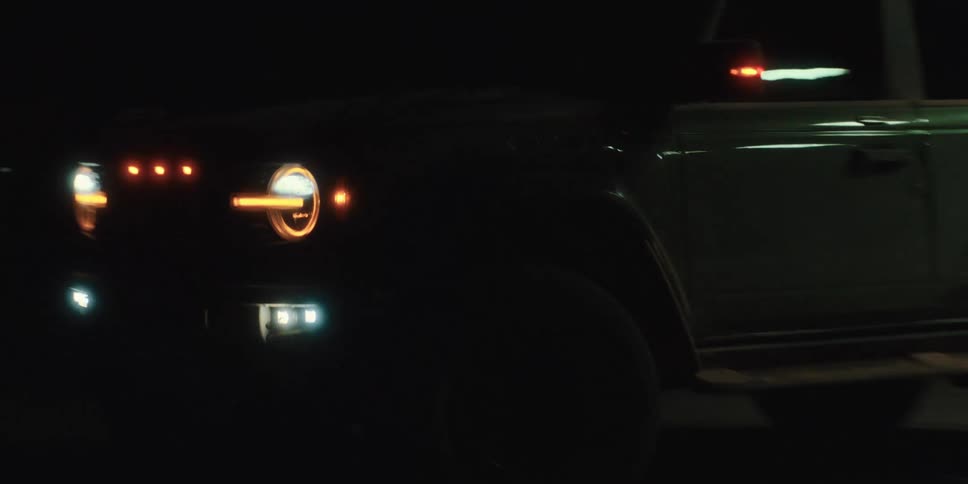 A vehicle drives away from a gas pump