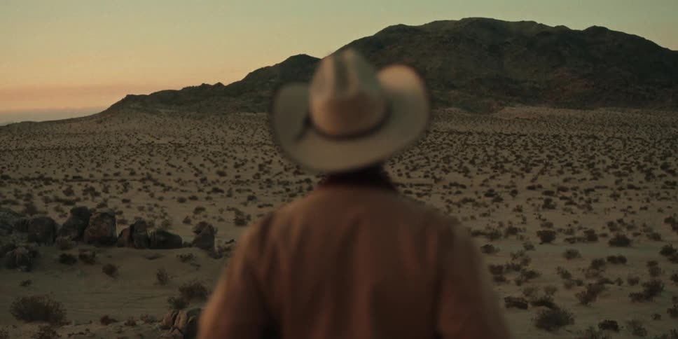 A man is watching the sunset