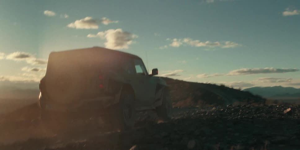 The truck is driving off road