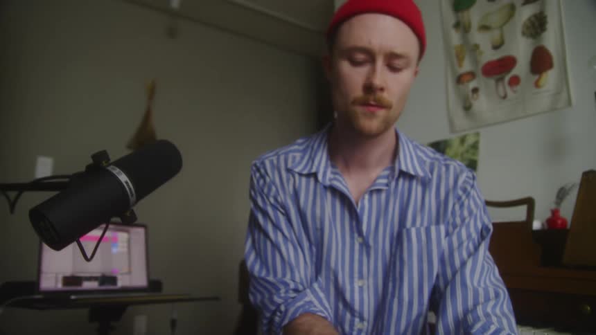 A man is playing the keyboard