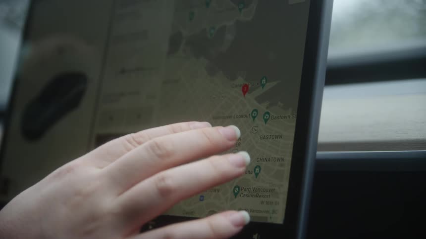 Person is looking at maps on a touch tablet