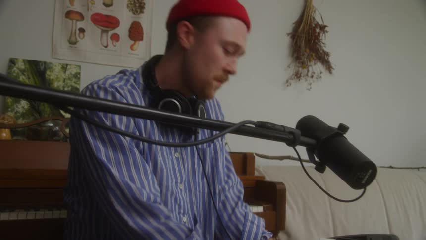 Man sitting having fun while playing an electronic piano