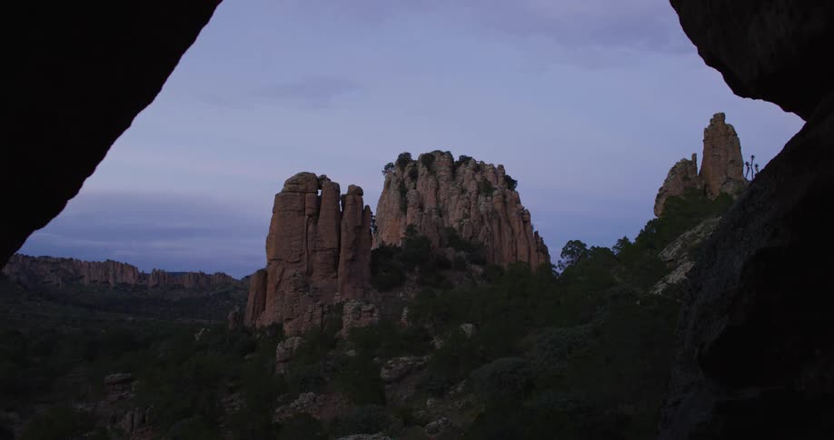 Scenery with canyons cliffs and erosions in a purple morning sky