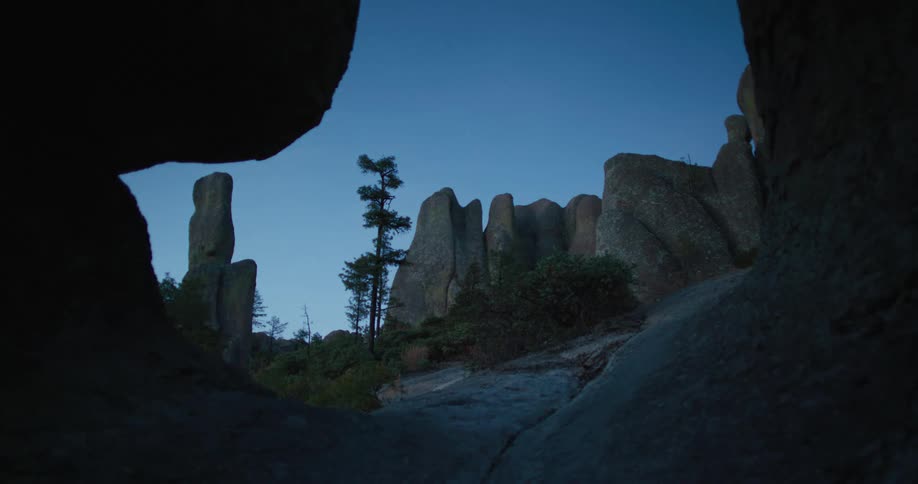 The cave entrance is dark