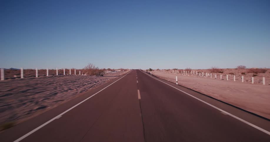 A road stretching across a desert