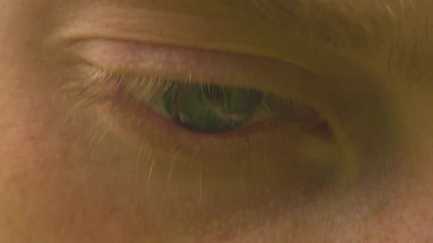 A person is blinking their eye