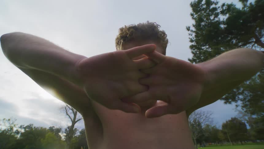 Man is dancing and covering his face with his hands
