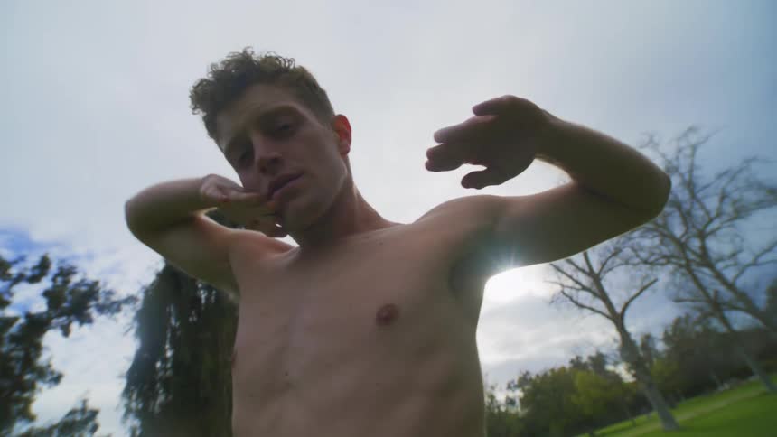 A man is stretching outside